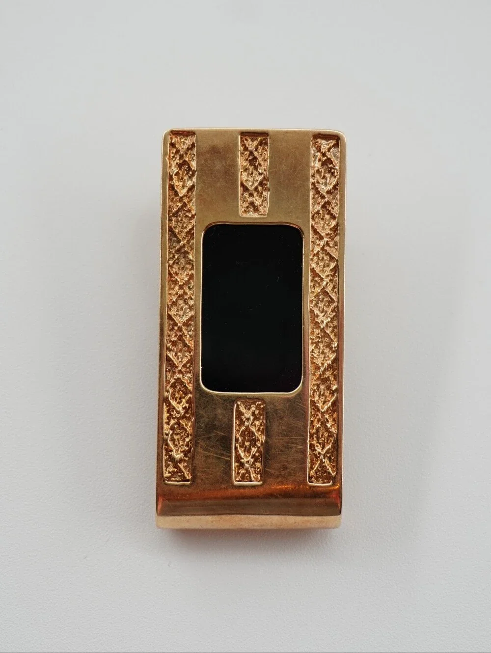 The Vintage Hofra 14k Money Clip is a luxurious accessory for men, weighing 21.3